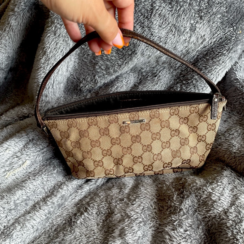 Purchased in Italy on vacation. Pre loved Gucci monogram small bag.